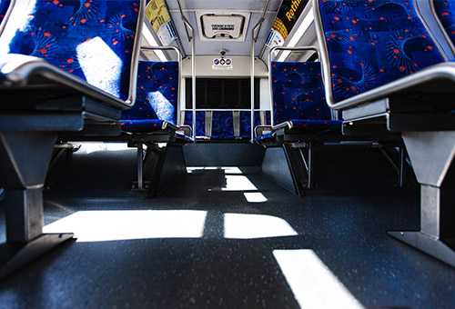 View of baggage space under bus seats